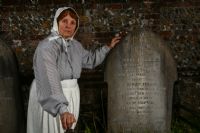 The ghost of Sarah Louise Hopson stands next to the grave of her daughter.: Click to enlarge